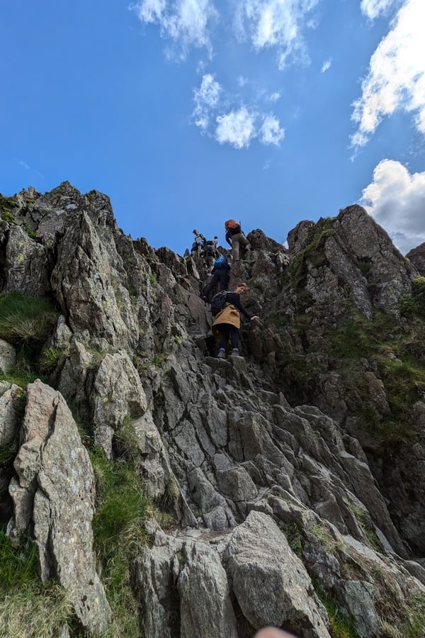 Hiking Helvellyn via Striding Edge - climbing down the chimney